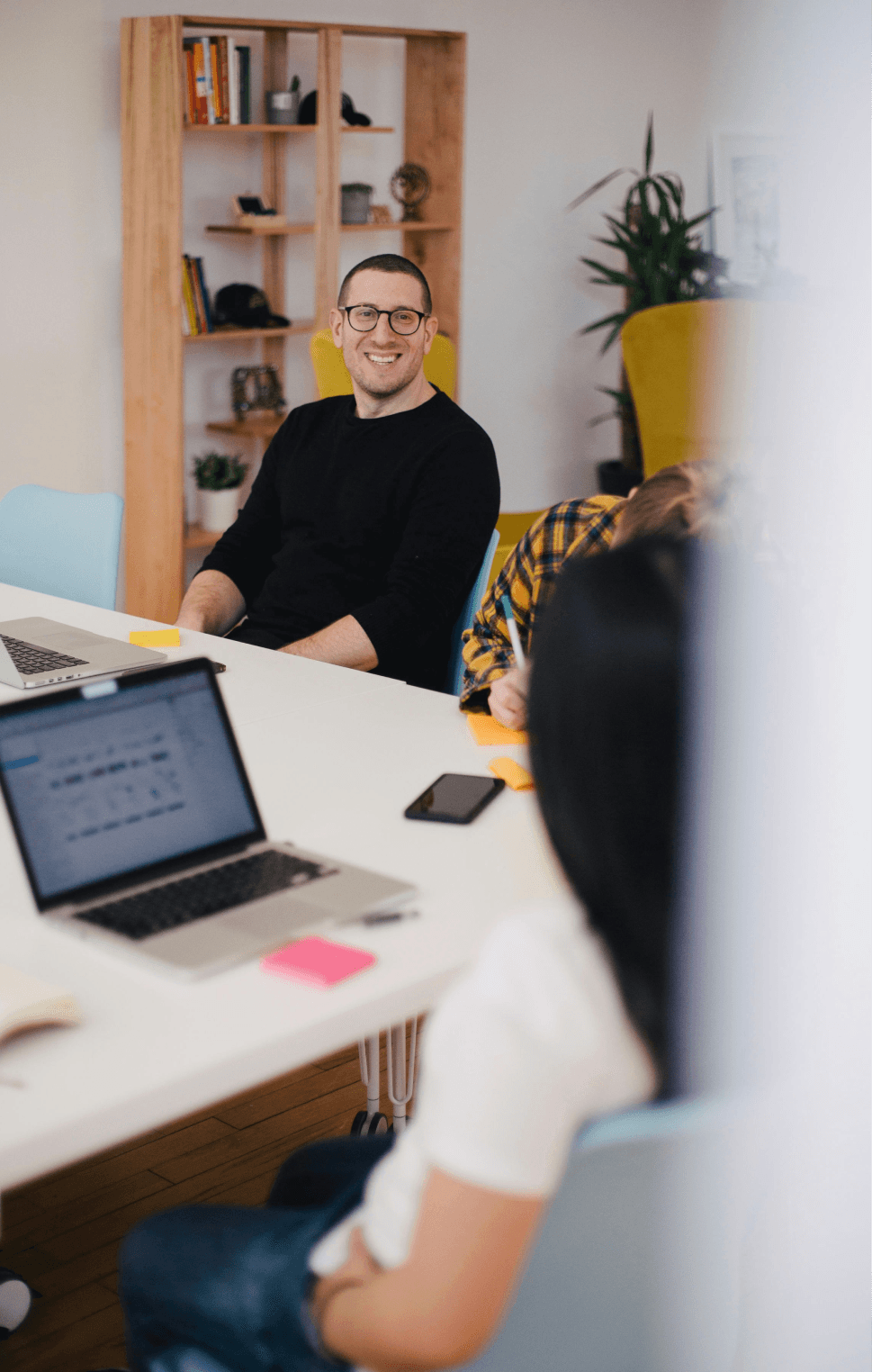 Man smiling in an office environment